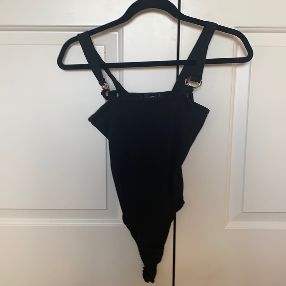 Black bodysuit with clasps at shoulder